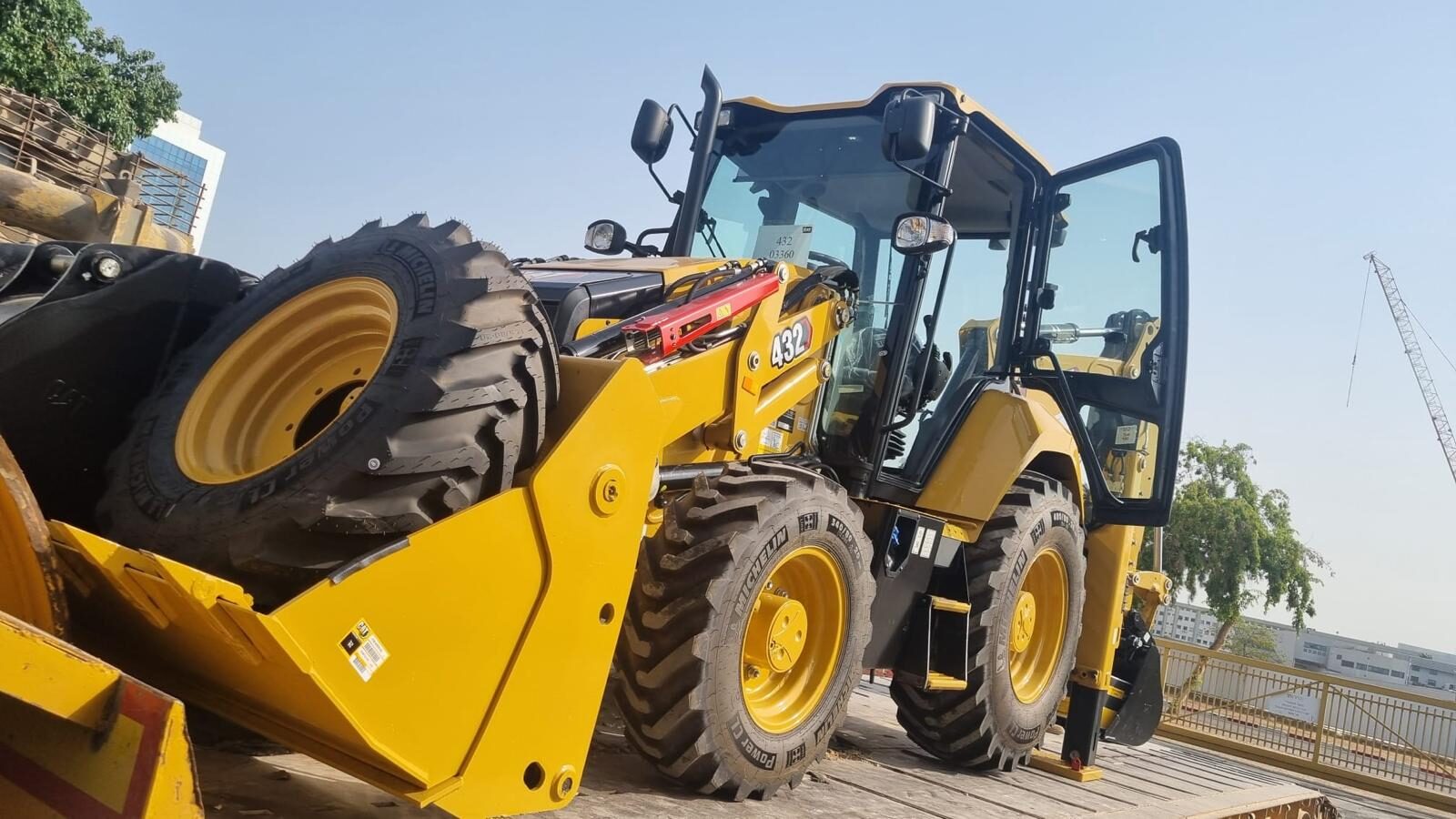 Brand-new CAT 432 backhoe loader on delivery